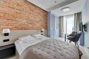 Postel nebo postele na pokoji v ubytování Comfort Apartments Granaria
