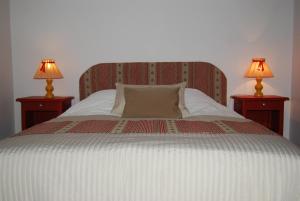 Postel nebo postele na pokoji v ubytování Gîtes Le Tokay et Le Muscat