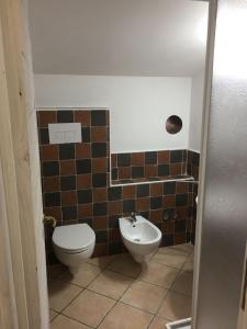 a bathroom with a toilet and a bidet at Villa Alessandra in Maratea