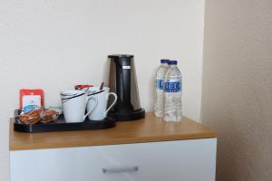 a shelf with a bottle of water and other items on it at Huntsman Tavern in Salisbury