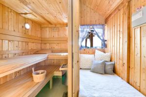 a wooden sauna with a bed in it at Holiday Home Dika in Sveti Martin na Muri