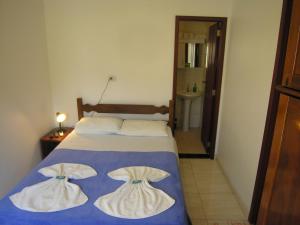 Postel nebo postele na pokoji v ubytování Jabaquara Beach Resort
