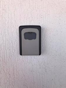 a black electrical outlet on a white wall at Вила Мариам Villa Mariam in Batak