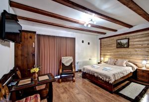 Postel nebo postele na pokoji v ubytování Magnat Inn Sauna & Relax
