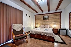 Postel nebo postele na pokoji v ubytování Magnat Inn Sauna & Relax