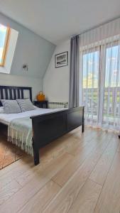 Posteľ alebo postele v izbe v ubytovaní Apartamenty GÓRKA