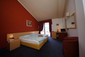 Katil atau katil-katil dalam bilik di Hotel Alpi