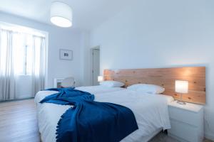 Postel nebo postele na pokoji v ubytování Lagoa Hostel & Suites