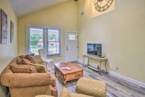 a living room with two couches and a tv at Family Home Walk to Downtown and Stetson Univ! in DeLand