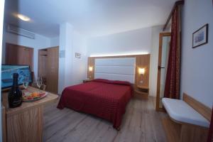 Katil atau katil-katil dalam bilik di Hotel Alpi
