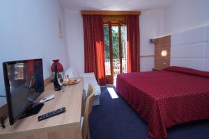 Katil atau katil-katil dalam bilik di Hotel Alpi