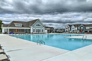 a large swimming pool in front of a house at Bright Bishops Landing Home Less Than 5 Miles to Beach! in Millville