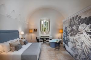 Posteľ alebo postele v izbe v ubytovaní Palazzo Donna Elisabetta + 37 fotografií