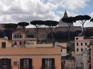 a view of a city with trees in the background at Mocenigo Vatican Suites in Rome