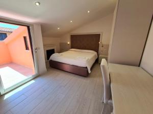 Voodi või voodid majutusasutuse L'Isola nel Parco Boutique Rooms & Apartments toas