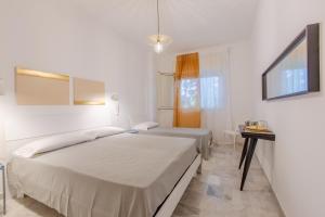 Ένα ή περισσότερα κρεβάτια σε δωμάτιο στο Villa Asami