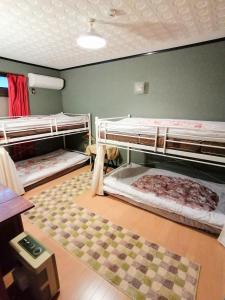 Postel nebo postele na pokoji v ubytování 静かに過ごす古民家ステイ Staying quietly in renovated house