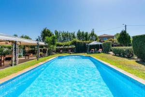a swimming pool in the backyard of a house at 5 bedrooms villa with private pool enclosed garden and wifi at Penafiel in Penafiel