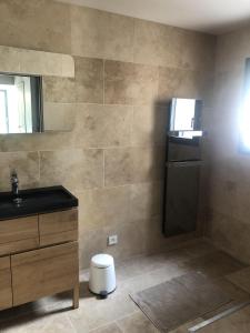 a bathroom with a sink and a mirror at L'ete Indien 2 in Sanary-sur-Mer