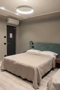 Кровать или кровати в номере Hotel Graziella