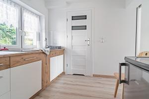 Kuchyňa alebo kuchynka v ubytovaní Apartament Dwie Doliny