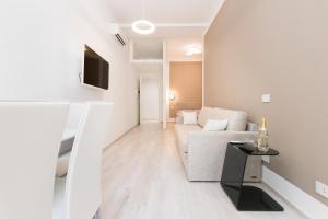A television and/or entertainment centre at MagnoliaApartments - 18A Visconti Duomo