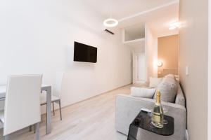 A television and/or entertainment centre at MagnoliaApartments - 18A Visconti Duomo