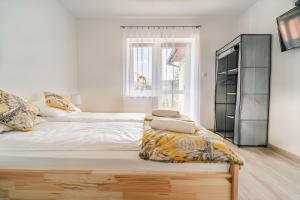 Posteľ alebo postele v izbe v ubytovaní Apartament Dwie Doliny