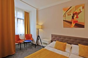 Postel nebo postele na pokoji v ubytování Hotel Pilgrim