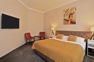Postel nebo postele na pokoji v ubytování Hotel Pilgrim