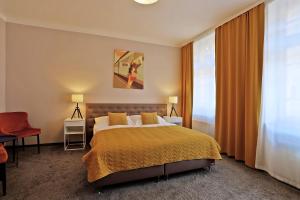 Postel nebo postele na pokoji v ubytování Hotel Pilgrim
