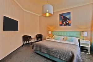 Postel nebo postele na pokoji v ubytování Hotel Pilgrim