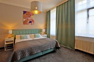 Postel nebo postele na pokoji v ubytování Hotel Pilgrim