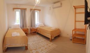 Postel nebo postele na pokoji v ubytování merih butik hotel