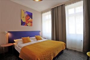 Postel nebo postele na pokoji v ubytování Hotel Pilgrim