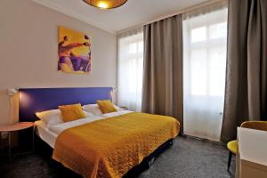 Postel nebo postele na pokoji v ubytování Hotel Pilgrim