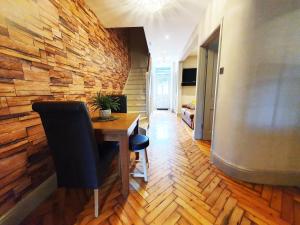 a room with a desk and a brick wall at St Paul's Studios apartment in London