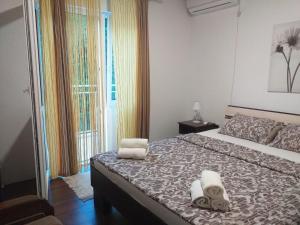Postel nebo postele na pokoji v ubytování Apartman Vesna