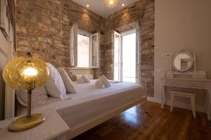 Voodi või voodid majutusasutuse La Cantada - Renovated apartment in Corfu town toas