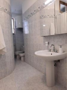 Ванна кімната в Casa Vacanze le Palme Netine