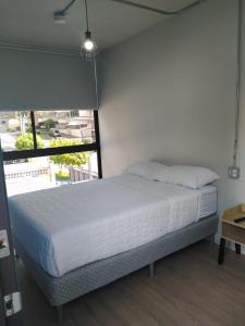 Postel nebo postele na pokoji v ubytování Nomada Republic Hotel Panama City