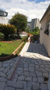 a stone walkway in front of a building at Milović apartmani in Igalo