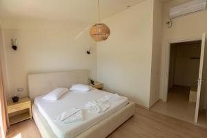Postel nebo postele na pokoji v ubytování Hotel Picasso