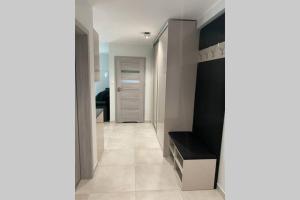 Posteľ alebo postele v izbe v ubytovaní Apartament w Międzywodziu z parkingiem