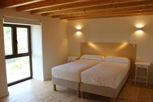 Ένα ή περισσότερα κρεβάτια σε δωμάτιο στο Apartamentos Samitier Casa Cambra