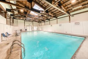 an indoor swimming pool with blue water at Mountain View at Mountainside in Stowe