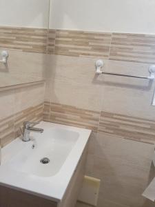 a bathroom with a white sink and a shower at B&B Castrum in Santo Padre