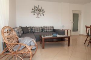 a living room with a couch and a table at Nikas1 Rabac in Rabac