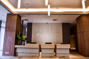 a lobby with a table and chairs in a building at Rio Hotel by Bourbon São Paulo Barra Funda in Sao Paulo