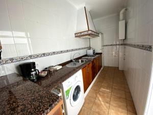 Kuchyň nebo kuchyňský kout v ubytování Apartamento Hostal Mellizo